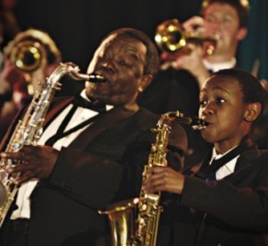 Hlayani Junior Mabasa (right) plays Felix, A South African boy with jazz dreams.