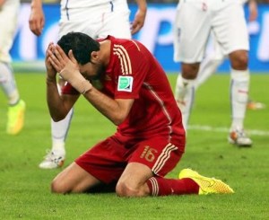 Spanish player Sergio Busquets is devastated after Spain's loss to Chile. That loss prevents Spain from advancing past the Group Stage.